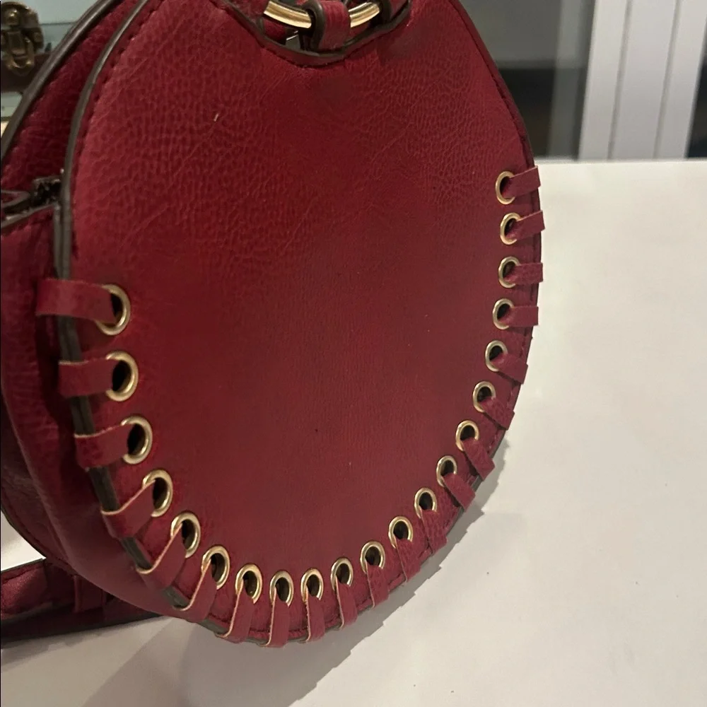 Carlos Santana faux pebbled leather maroon western crossbody bag laser cut rings